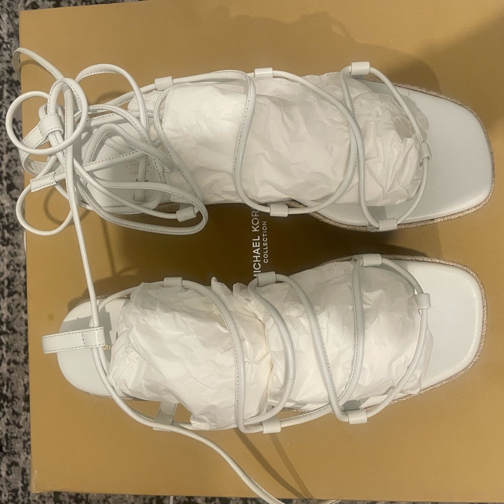 Michael Kors 8.5 shoes. Brand new. Never worn. White straps add sexy swag.